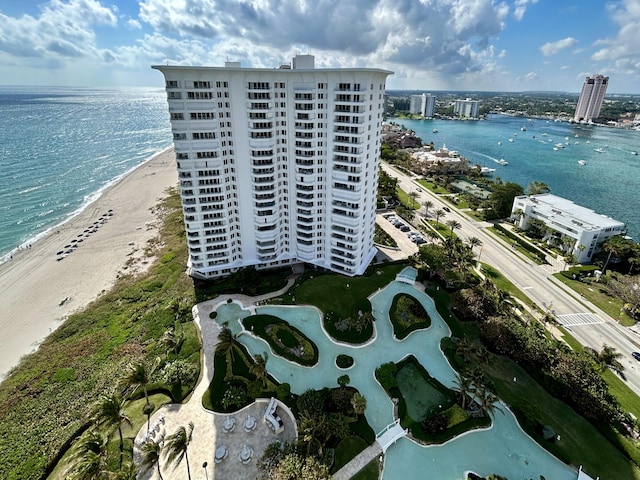 aerial view with a water view and a beach view