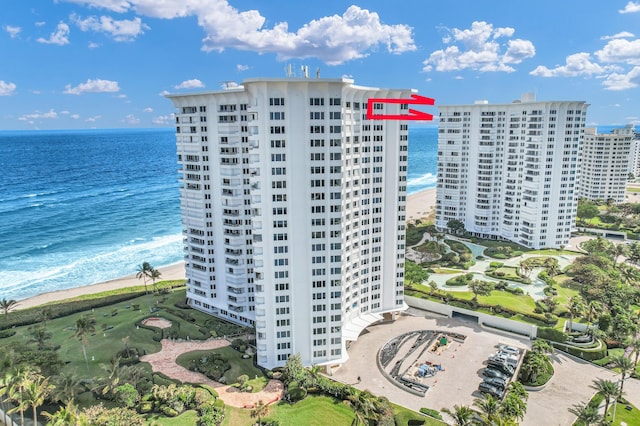 aerial view featuring a water view and a view of the beach