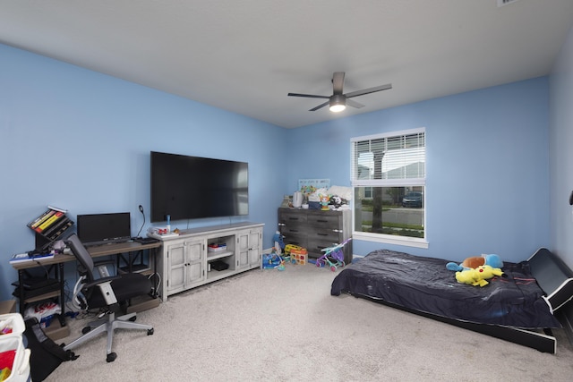 bedroom with light carpet and ceiling fan