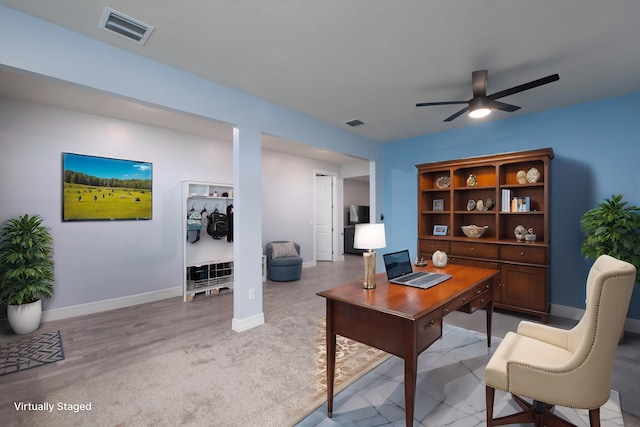 office area with light wood-type flooring and ceiling fan