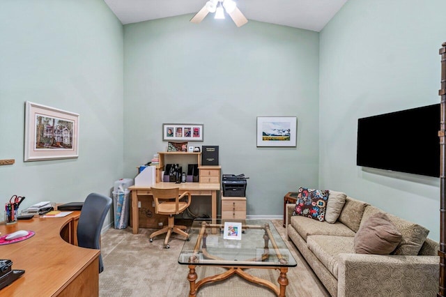 carpeted office with ceiling fan and vaulted ceiling