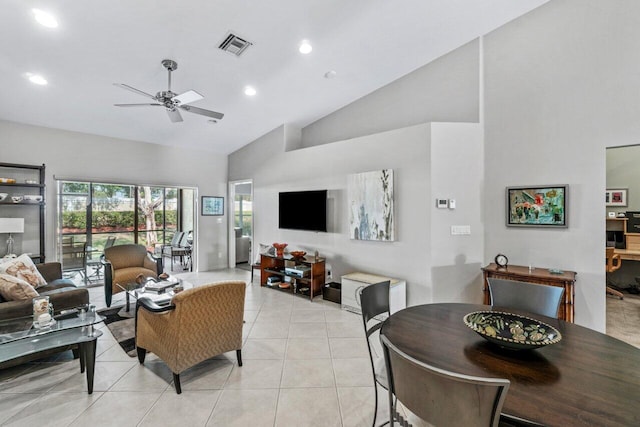 living room with light tile patterned flooring, ceiling fan, and high vaulted ceiling