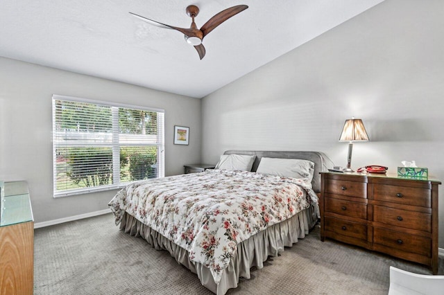 carpeted bedroom featuring ceiling fan and vaulted ceiling