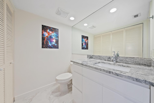 bathroom with vanity and toilet