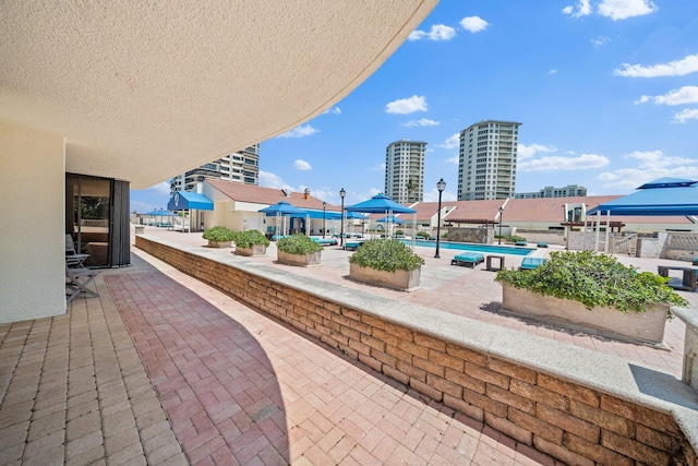 view of patio / terrace featuring a community pool