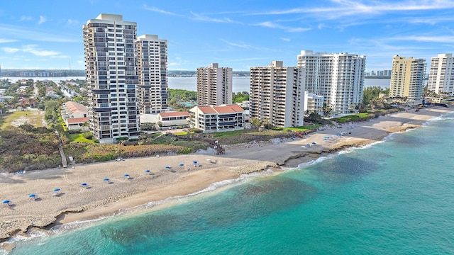 bird's eye view with a view of the beach and a water view