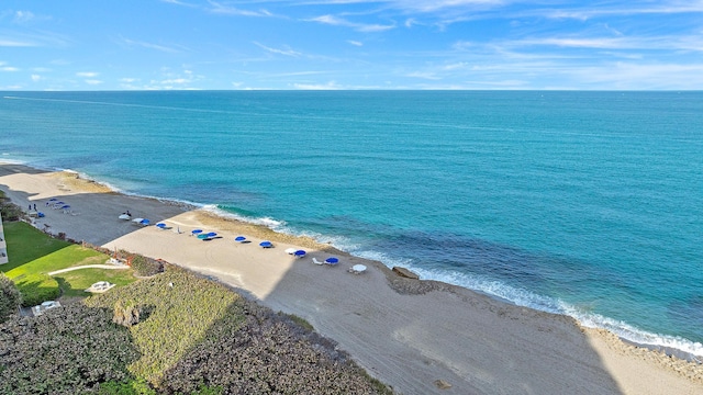 bird's eye view featuring a view of the beach and a water view