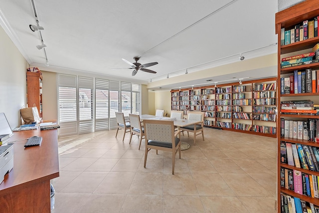 tiled dining room with rail lighting and ceiling fan