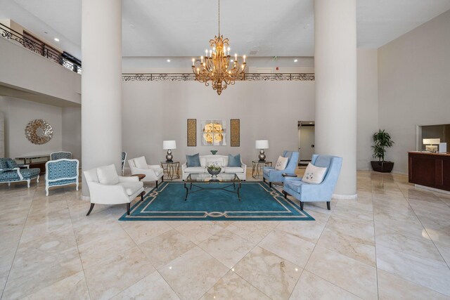 kitchen with sink, ornamental molding, stainless steel dishwasher, light tile patterned floors, and a tray ceiling