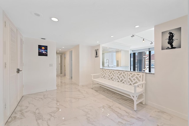 hallway featuring sink