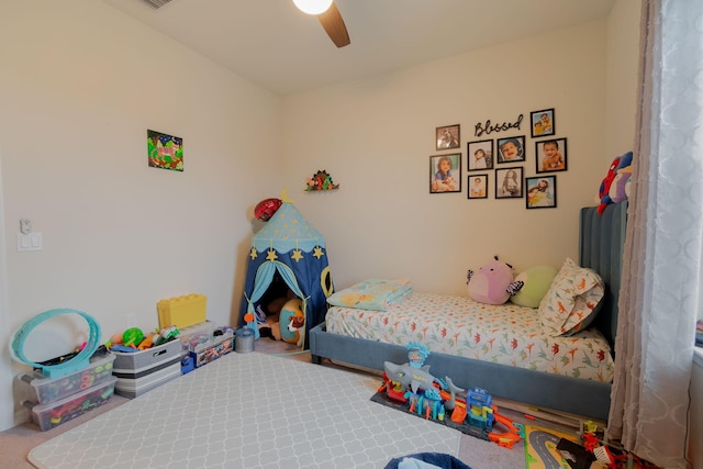 carpeted bedroom with ceiling fan