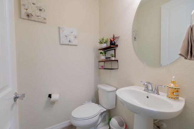 bathroom with toilet and sink