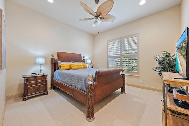 bedroom with light colored carpet and ceiling fan