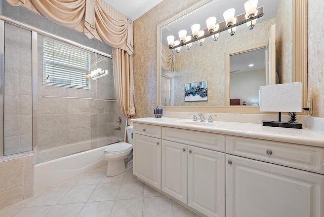 full bathroom with vanity, tile patterned floors, shower / bath combination with glass door, and toilet