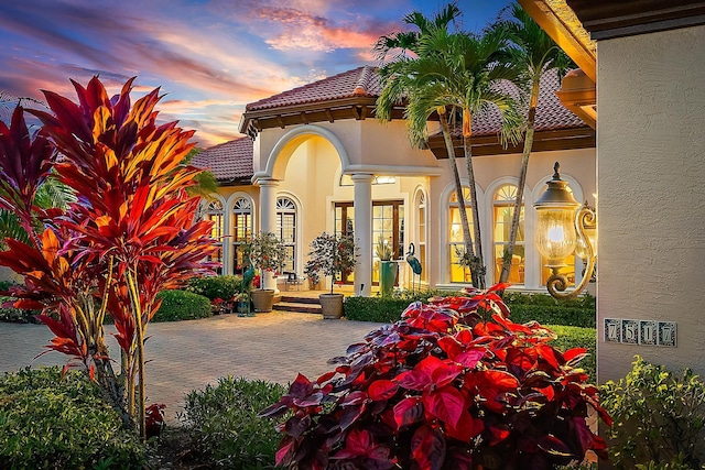 view of patio terrace at dusk