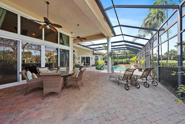 view of patio / terrace with a lanai and ceiling fan