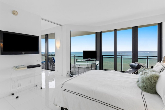 bedroom with tile patterned flooring and access to outside