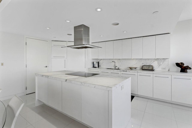 kitchen with island exhaust hood, a sink, backsplash, a kitchen island, and black electric stovetop