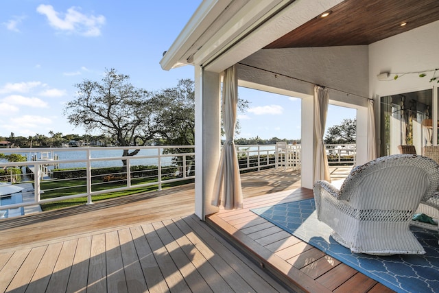 deck featuring a water view