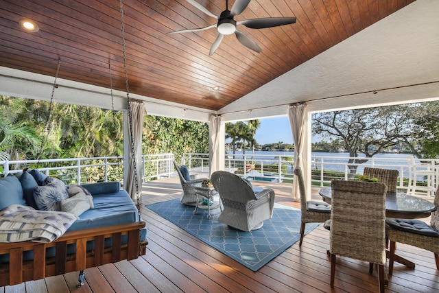 wooden terrace featuring ceiling fan