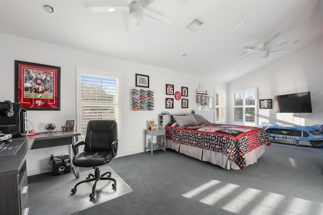 carpeted bedroom featuring ceiling fan and vaulted ceiling