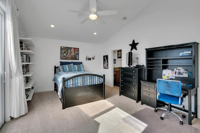 carpeted bedroom with ceiling fan and vaulted ceiling