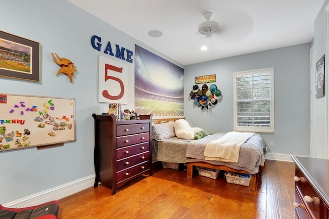 bedroom featuring hardwood / wood-style flooring and ceiling fan