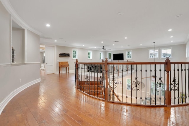 hall with crown molding and hardwood / wood-style floors