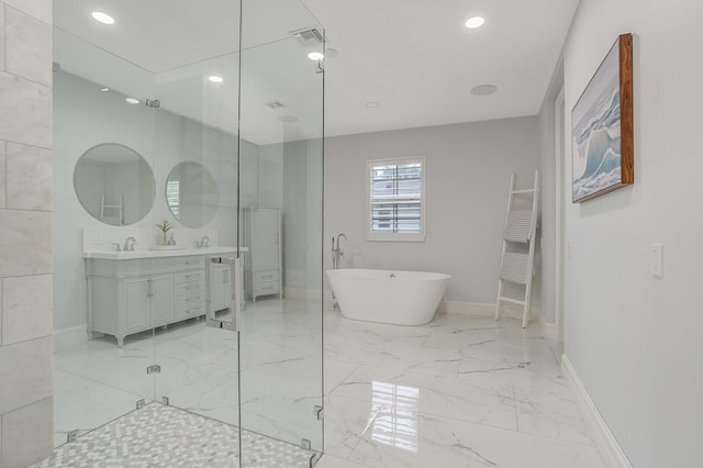 bathroom with vanity and independent shower and bath