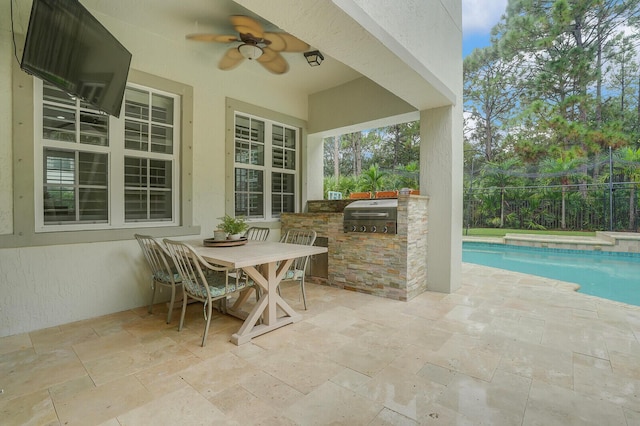 view of patio with a fenced in pool, area for grilling, exterior bar, a grill, and ceiling fan