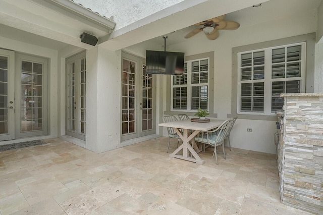 view of patio / terrace with ceiling fan and french doors