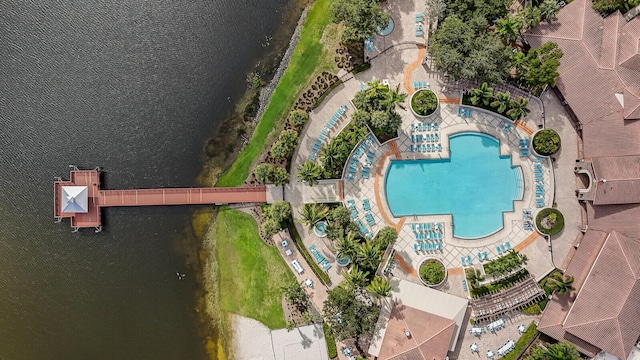 birds eye view of property with a water view