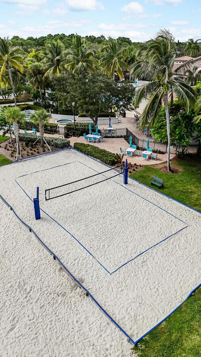 view of property's community featuring volleyball court and a patio area