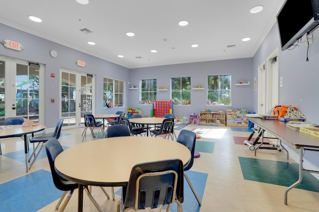 interior space featuring ornamental molding and french doors