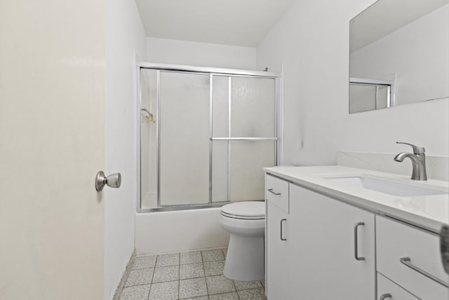 full bathroom with toilet, vanity, and shower / bath combination with glass door