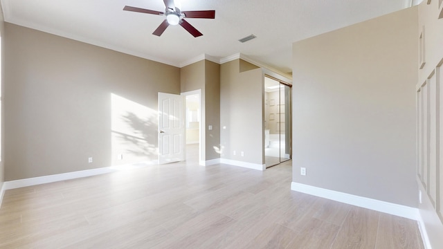 unfurnished living room with crown molding, light hardwood / wood-style flooring, and ceiling fan