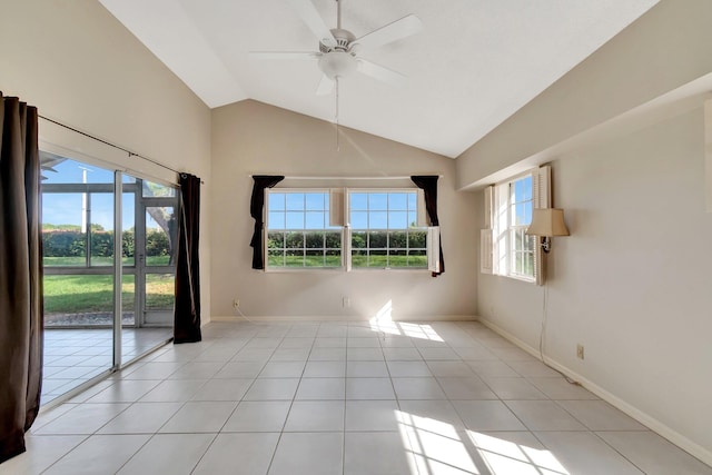 spare room with light tile patterned flooring, ceiling fan, and lofted ceiling