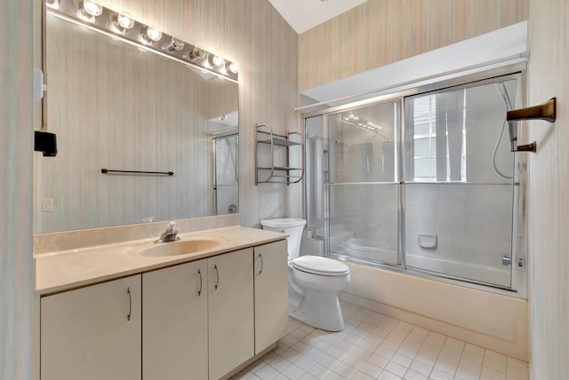 full bathroom featuring enclosed tub / shower combo, toilet, tile patterned floors, and vanity