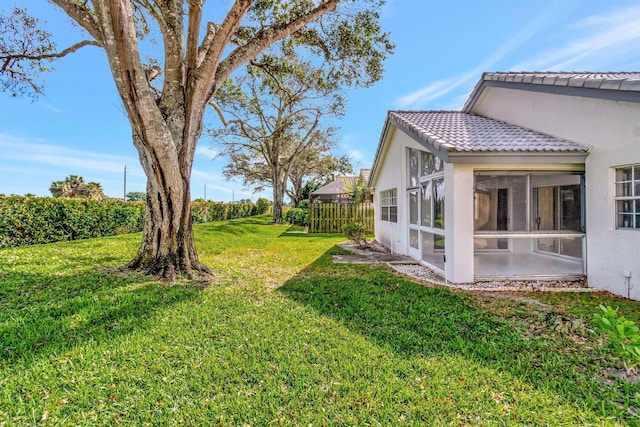 view of yard featuring a sunroom