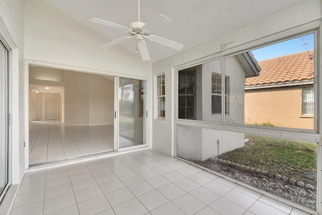 unfurnished sunroom with ceiling fan and lofted ceiling