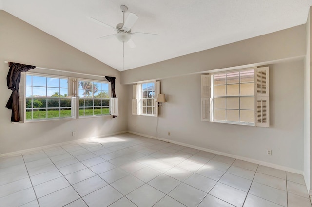 tiled empty room featuring ceiling fan and lofted ceiling