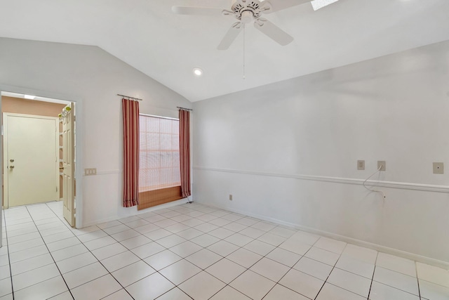 tiled empty room with lofted ceiling and ceiling fan