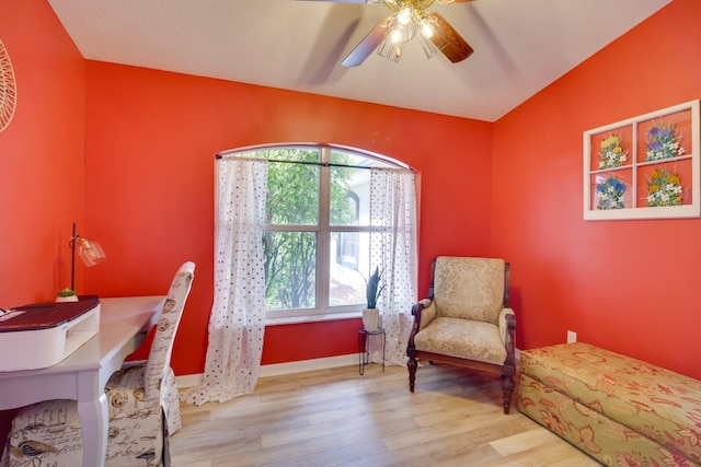 office with vaulted ceiling, wood finished floors, a ceiling fan, and baseboards