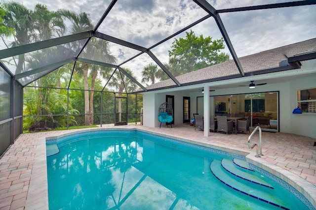 pool with a lanai, a patio area, ceiling fan, and outdoor lounge area