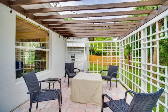 view of patio / terrace featuring fence and a pergola