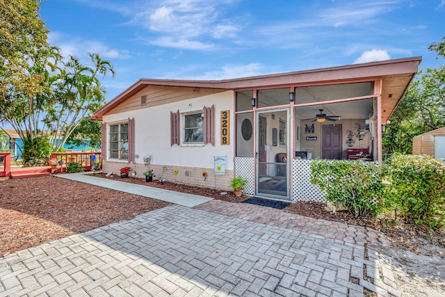 view of front of home featuring ceiling fan