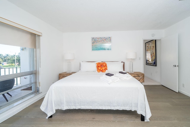 bedroom featuring dark wood-type flooring