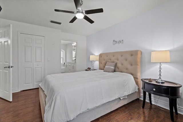 bedroom featuring ensuite bathroom, dark hardwood / wood-style floors, ceiling fan, and a closet