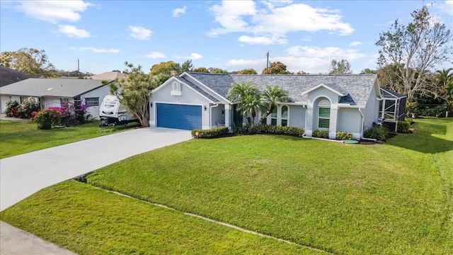 ranch-style house featuring a garage, a front yard, and glass enclosure