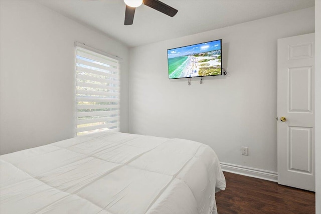 bedroom featuring dark hardwood / wood-style floors and ceiling fan